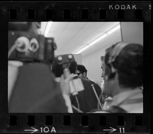View from behind reporters with cameras at Boston Redevelopment Authority sit-in