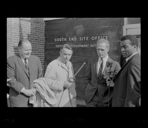 Hale Champion, left, and Mayor Kevin White, second from right, standing with two other men outside Boston Redevelopment Authority South End office