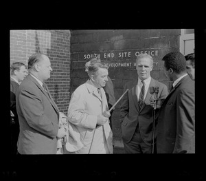 Hale Champion, left, and Mayor Kevin White, second from right, standing with two other men outside Boston Redevelopment Authority South End office