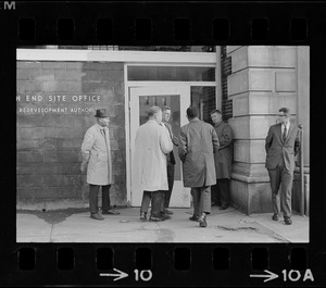 Group of men outside entrance of Boston Redevelopment Authority South End office