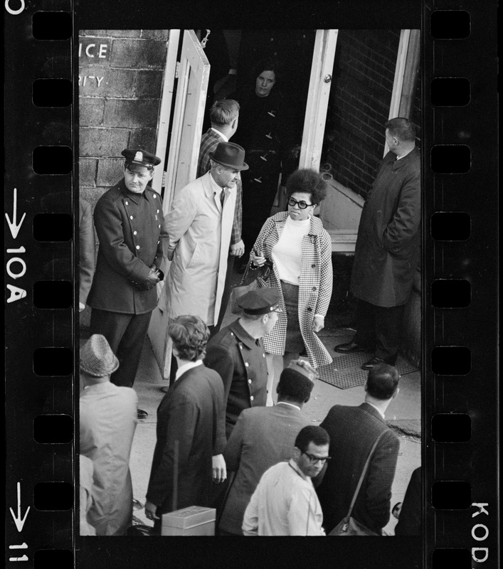 A woman exiting the Boston Redevelopment Authority South End office