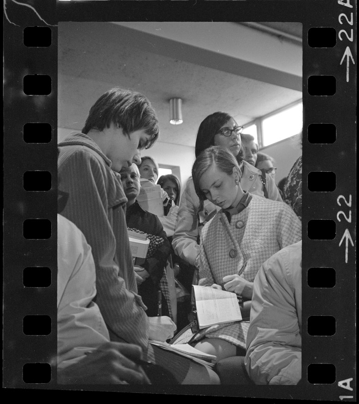 Group of students writing in notebooks during sit-in