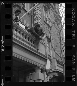 Students involved in sit-in hoist a television up to balcony of Boston University administration building