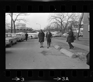 Morris B. Abram, right, resident of Brandeis University and another man, walking along road at Brandeis University