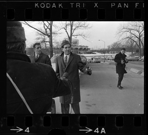 Morris B. Abram, right, president of Brandeis University and another man being approached by journalist at Brandeis University