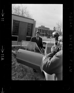 Morris B. Abram, president of Brandeis University, getting into car