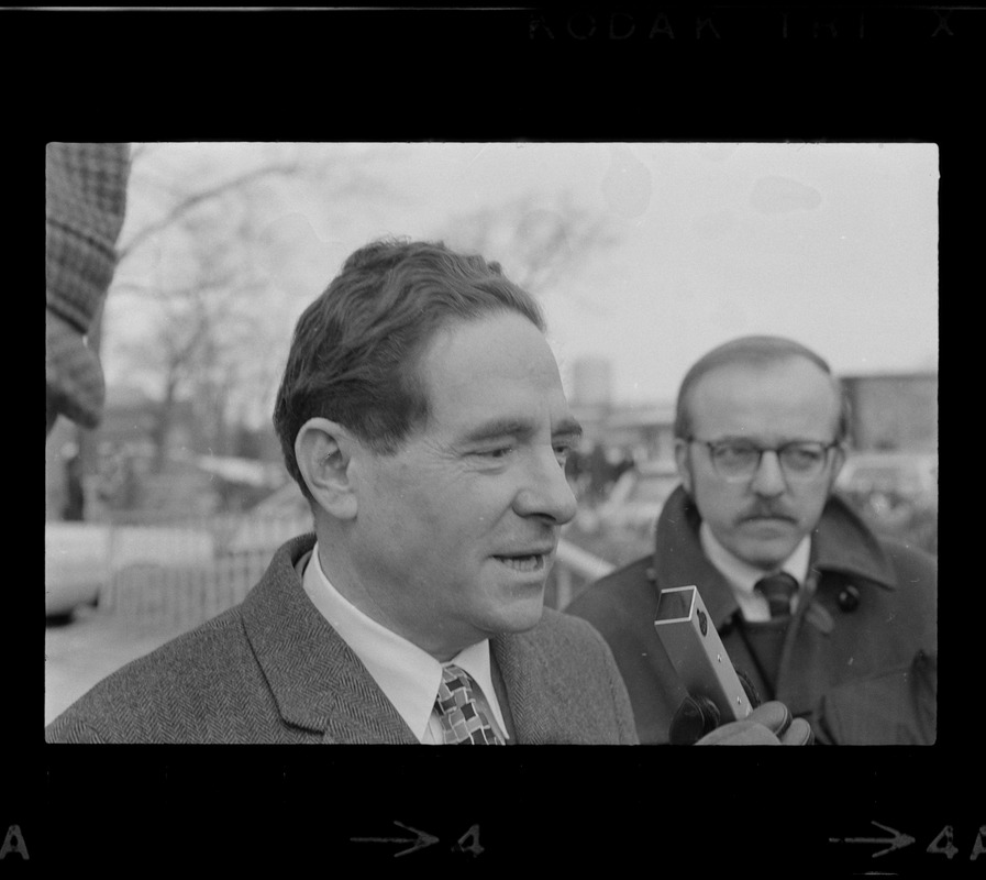 Morris B. Abram, president of Brandeis University, speaking into a microphone at Brandeis University