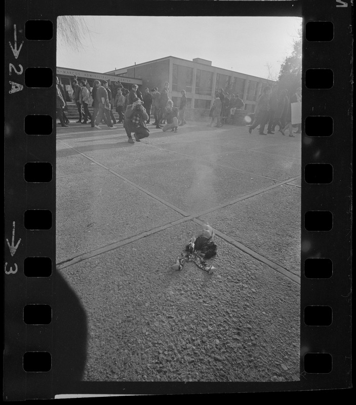 Symbolic doll seen on ground during Vietnam protest and sit-in at Brandeis University