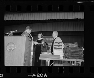 Coretta Scott King seen on stage receiving an honorary degree at the Brandeis University commencement exercises