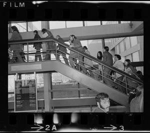 Students for a Democratic Society demonstrators ascending Boston University stairs in the George Sherman Union building