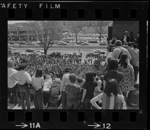 Group of people seen looking down at crowd of students during Students for a Democratic Society demonstration at Boston University