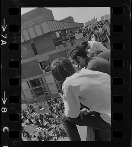 Students on balcony during Students for a Democratic Society disturbance at Boston University, crowd in foreground