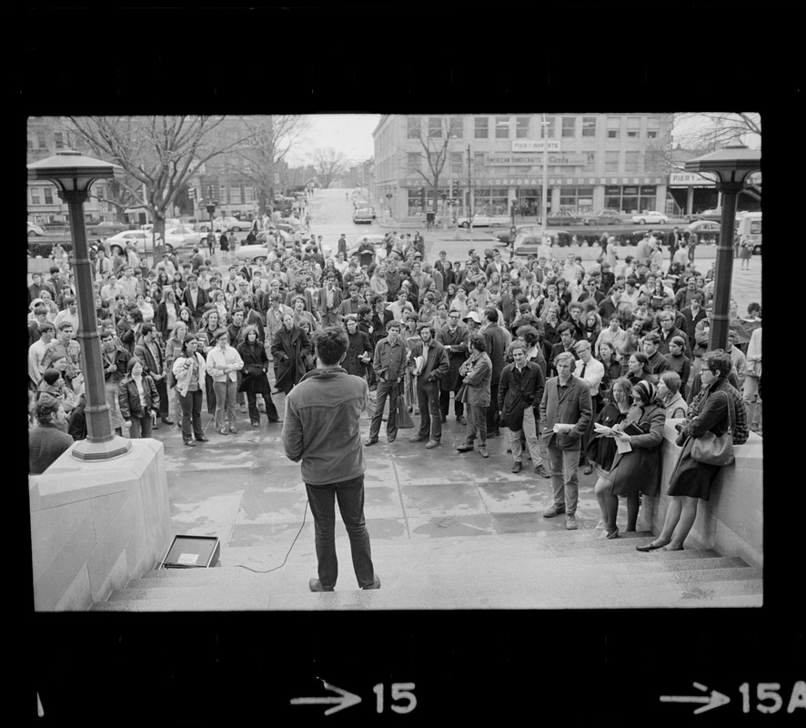 Student addressing crowd during rally in support of SDS members at Harvard