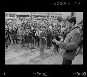 Student addressing crowd during rally in support of SDS members at Harvard