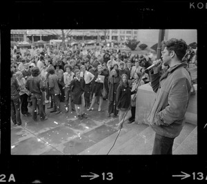 Student addressing crowd during rally in support of SDS members at Harvard