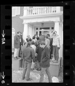 Students standing outside of Rev. Francis X. Shea's house while meeting occurred inside during Boston College sit-in by 30 black students