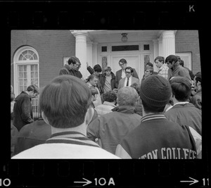 Man speaking to group of students outside of Rev. Francis X. Shea's house during Boston College sit-in by 30 black students