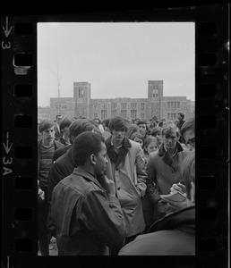 Black student representative seen in a crowd outside of Gasson Hall during Boston College sit-in
