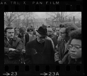 Rev. F.X. Shea, Executive Vice-President of Boston College, seen in middle of crowd during Boston College sit-in
