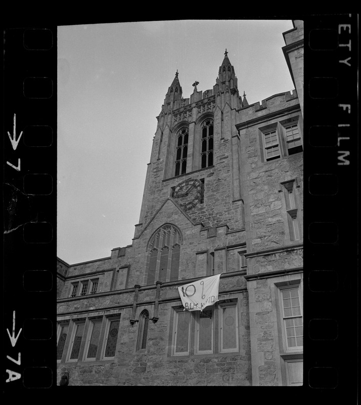 Exterior view of Gasson Hall tower with a banner during Boston College sit-in