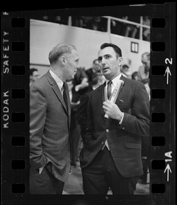 Boston College basketball coach Bob Cousy speaking with Providence College basketball coach Joe Mullaney
