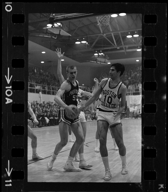 Providence College and Boston College players try to take possession of the ball during a basketball game