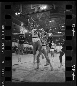 Boston College player (no. 10) attempting to make a shot during basketball game against Providence College