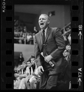 Providence College coach Joe Mullaney cheering from the sidelines during game against Boston College