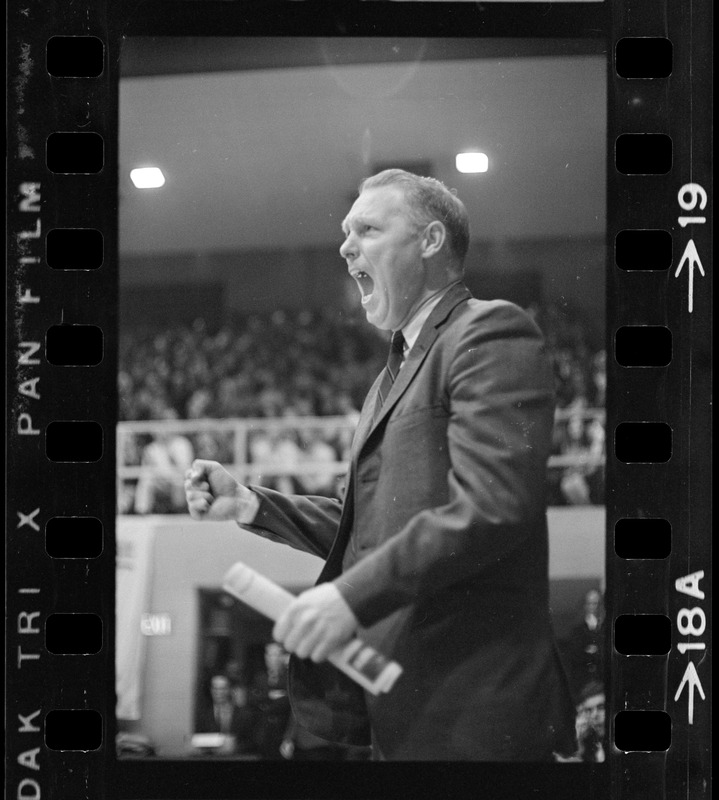 Providence College coach Joe Mullaney cheering from the sidelines during game against Boston College