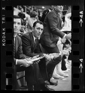 Boston College basketball coach Bob Cousy sitting on the bench during a game against Providence College