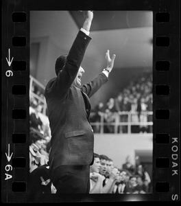 Boston College basketball coach Bob Cousy cheering from the sidelines during a game against Providence College