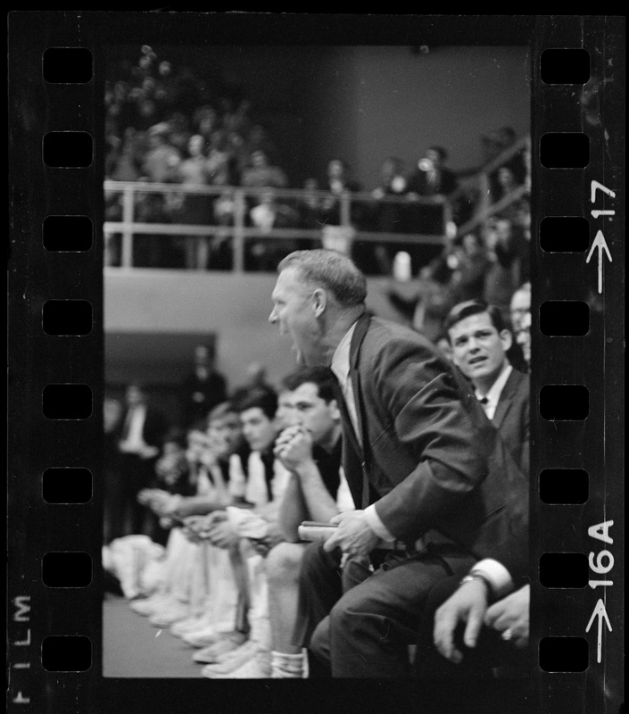 Providence College coach Joe Mullaney cheering from the sidelines during game against Boston College