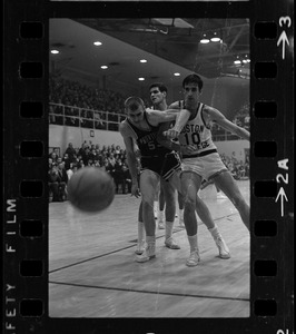 Boston College player (no. 10) defending against and Providence College player in basketball game