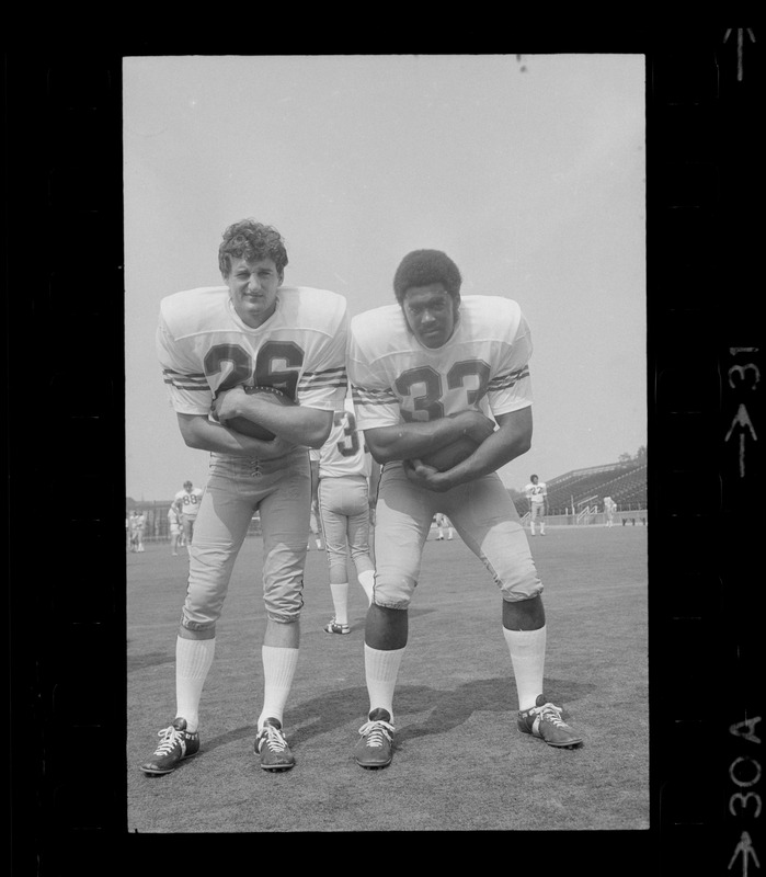 Boston College football players no. 28 and no. 33 cradle ball