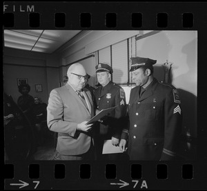 Police commissioner Edmund L. McNamara with newly promoted lieutenants Joseph V. Mills and Leroy B. Chase