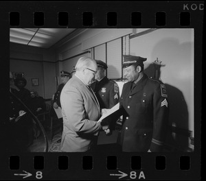 Police commissioner Edmund L. McNamara with newly promoted lieutenant Leroy B. Chase