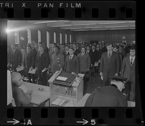 Boston police department recruits stand during swearing in as they start training