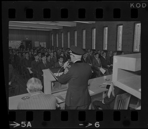 Chief Supt. William Taylor of the Boston Police department delivers the oath of their office to 170 new police department recruits as they start training