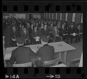 Group of 170 new police department recruits seated during ceremony to begin their training