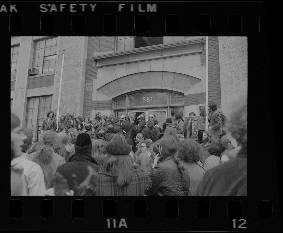 Police force challenge protestors from entering BU building located at 881 Commonwealth Ave.