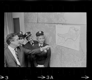 Boston Traffic Comr. William R. McGrath points out high fine area designated as Zone A to meter maids Lee Raftery, Mary Martin and Virginia Hartling