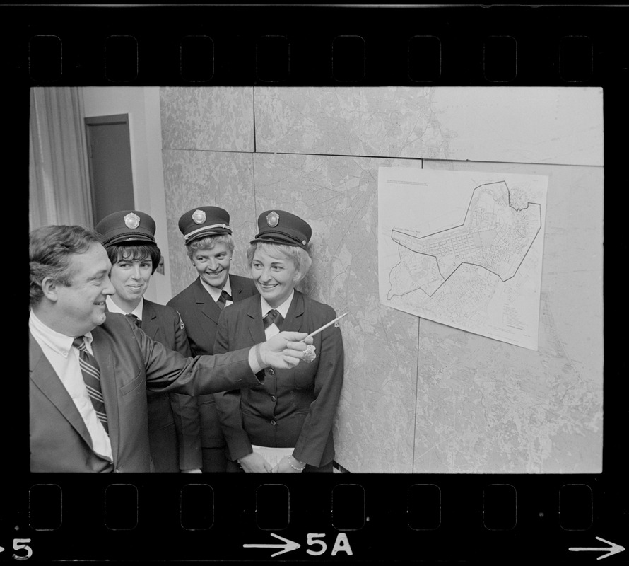 Boston Traffic Comr. William R. McGrath points out high fine area designated as Zone A to meter maids Lee Raftery, Mary Martin and Virginia Hartling