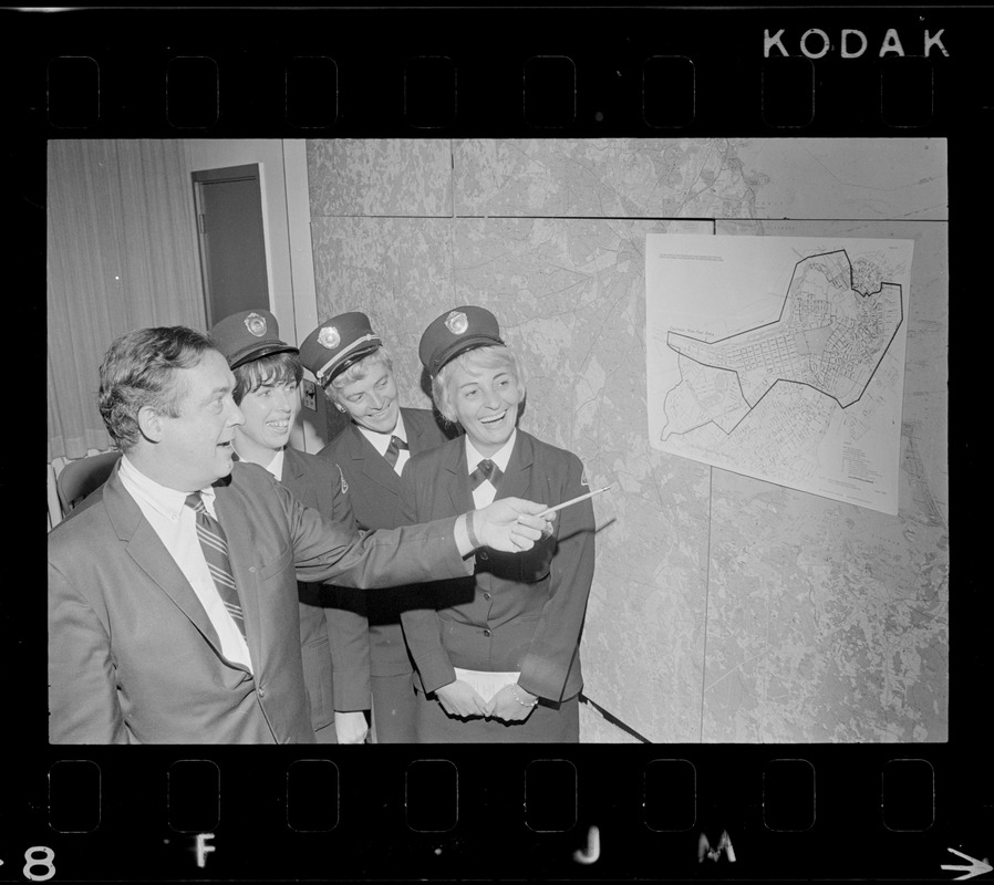 Boston Traffic Comr. William R. McGrath points out high fine area designated as Zone A to meter maids Lee Raftery, Mary Martin and Virginia Hartling