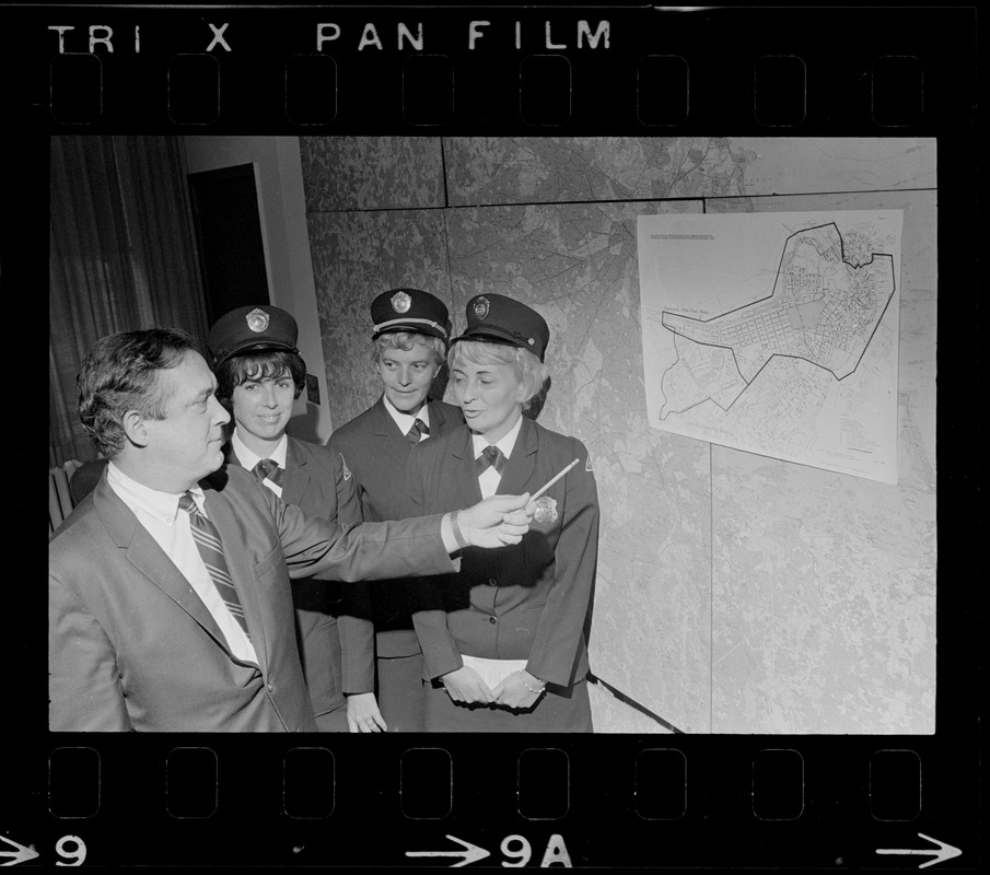 Boston Traffic Comr. William R. McGrath points out high fine area designated as Zone A to meter maids Lee Raftery, Mary Martin and Virginia Hartling