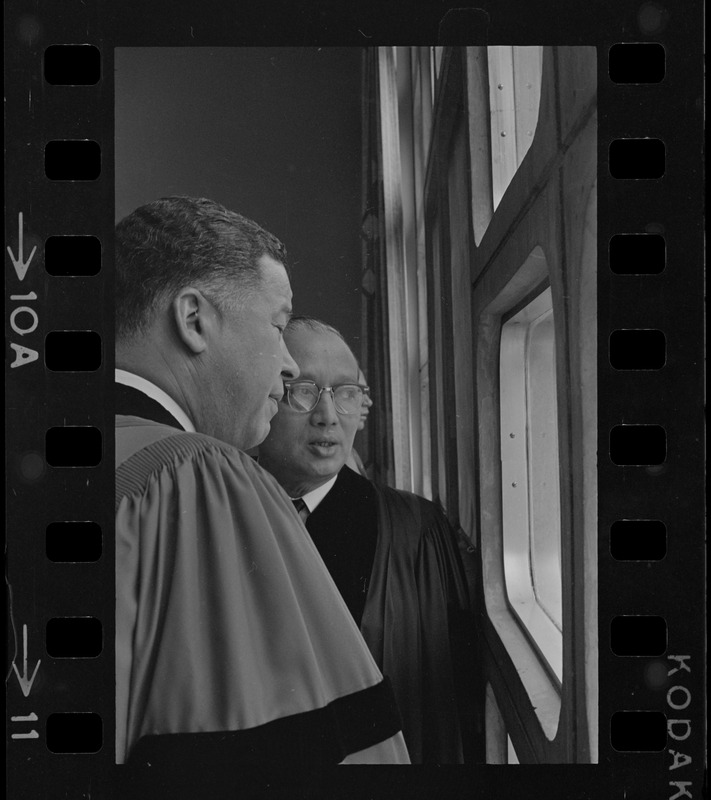 Senator Edward W. Brooke and U.N. Secretary General U Thant talking in front of window before Boston University commencement