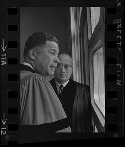 Senator Edward W. Brooke and U.N. Secretary General U Thant talking in front of window before Boston University commencement