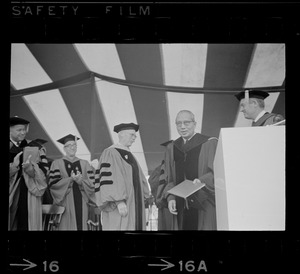 U.N. Secretary General U Thant, right, seen on stage during honorary degree ceremony at Boston University commencement