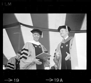 N.A.A.C.P. leader Roy Wilkins receiving honorary degree at Boston University commencement seen with President Arland Christ-Janer