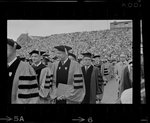 Chief editor of Time Hedley Donovan, left, and Senator Edward W. Brooke right, in procession at Boston University commencement