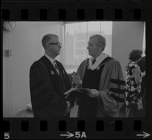 Tufts Pres. Burton C. Hallowell (left) chats with B.U. Pres. Arland Christ-Janer